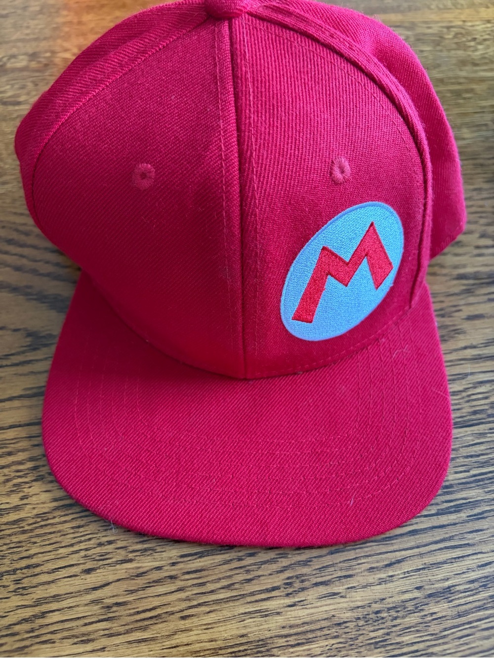 Red Men's Snapback Hat with Embroidered 'M' Logo